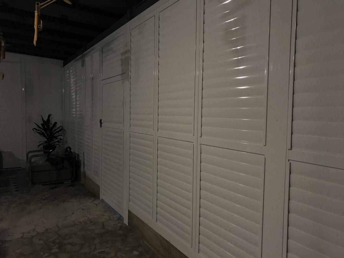 White Infinity Plantation Shutters as wall