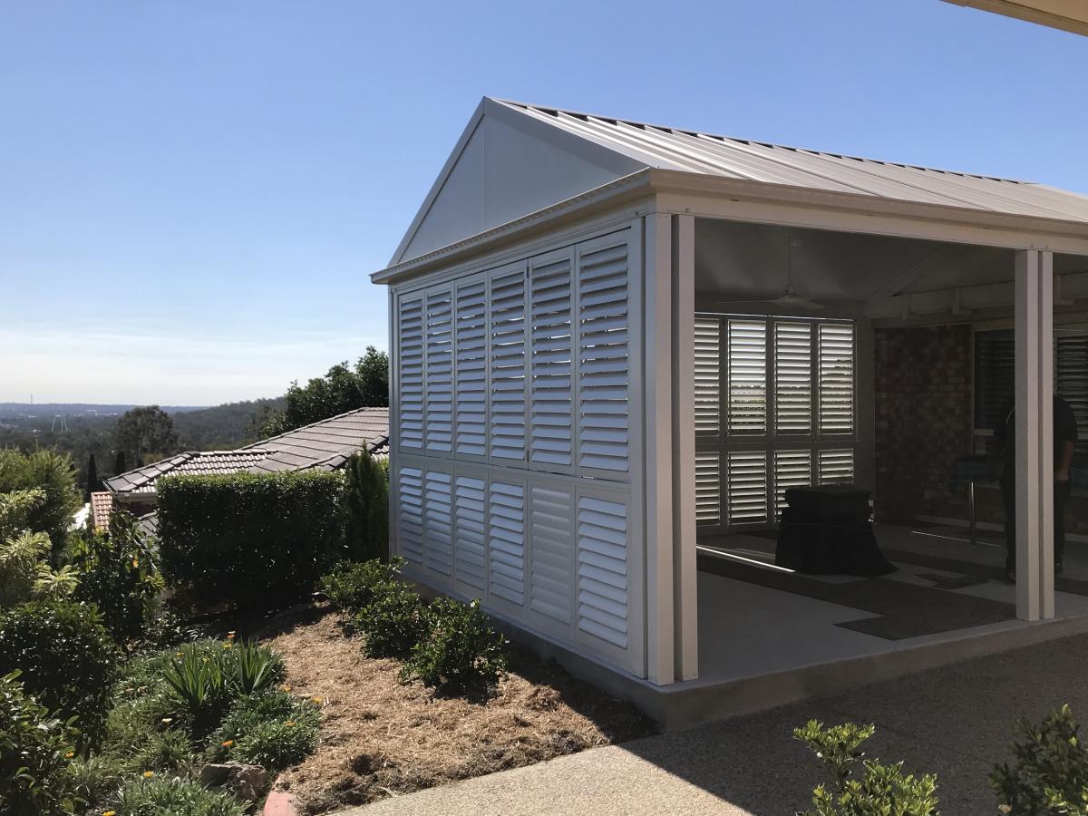 Separate room in the hills with plantation shutter as a wall