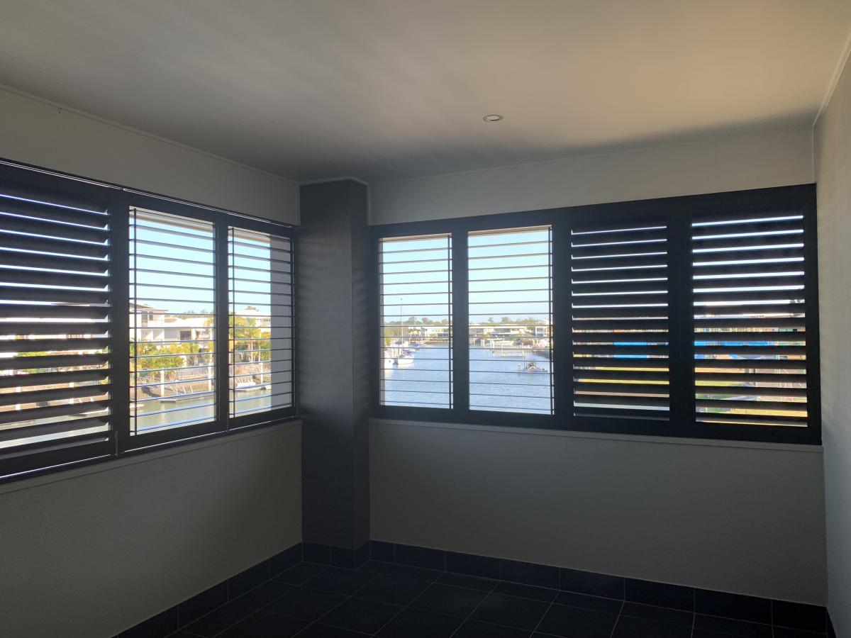 Dark colored Plantation Shutters in an empty space room