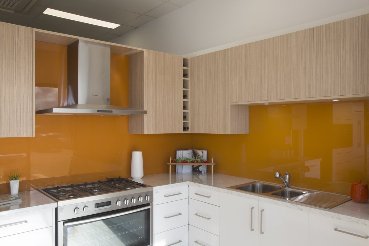 Modern Kitchen Glass Splashbacks in white with brown cabinets
